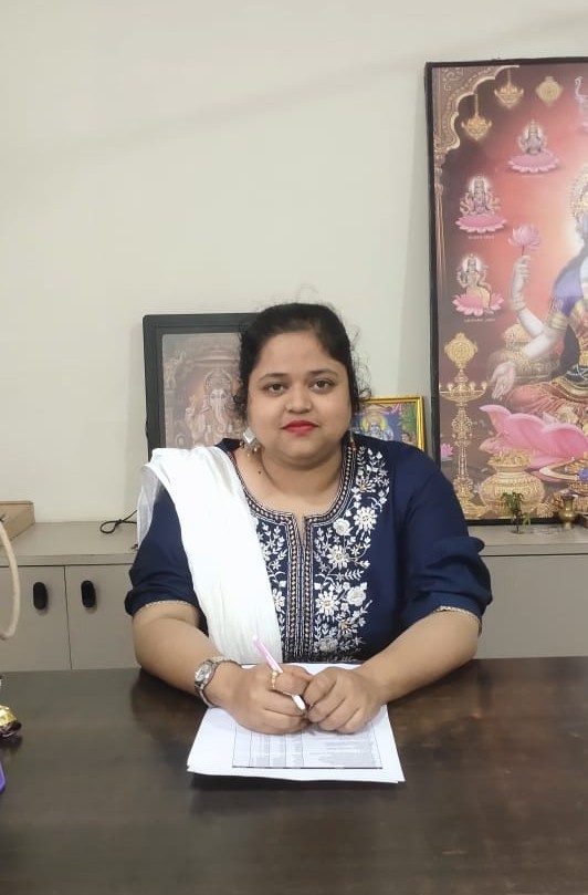Portrait of the principal smiling warmly in a colorful school hallway with children playing in the background